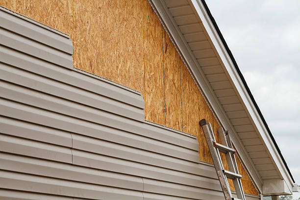 Professional Storm Damage Siding Repair technician working in New Florence, PA